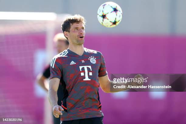Thomas Müller of FC Bayern München plays the ba during a training session at Saebener Strasse training ground ahead of their UEFA Champions League...