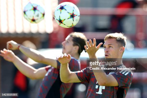 Joshua Kimmich of FC Bayern München plays the ball during a training session at Saebener Strasse training ground ahead of their UEFA Champions League...