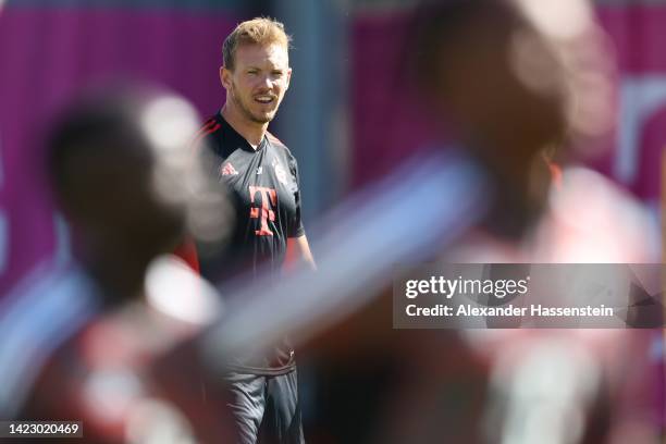 Julian Nagelsmann, head coach of FC Bayern München looks on during a training session at Saebener Strasse training ground ahead of their UEFA...