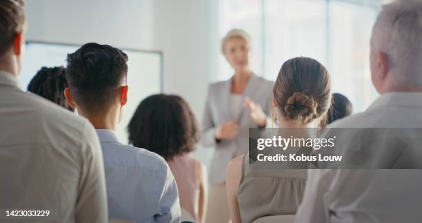 presentation, marketing and sales b2b strategy of elderly woman, ceo or team work leader. corporate advertising plan with female present sale analytics and logistics analytics to audience - senior orientation announcement stock pictures, royalty-free photos & images