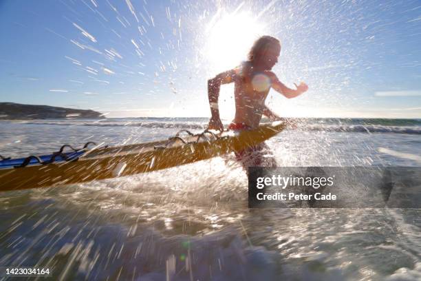 lifeguard running with rescue board - surf rescue stock pictures, royalty-free photos & images