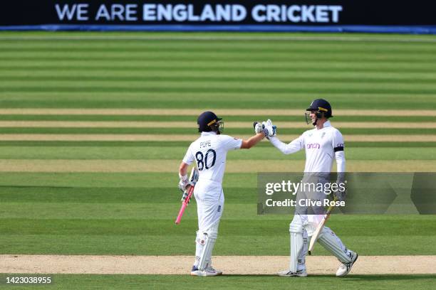 England opening batsman Zak Crawley and Ollie Pope celebrate the winning runs during day five of the Third LV= Insurance Test Match between England...