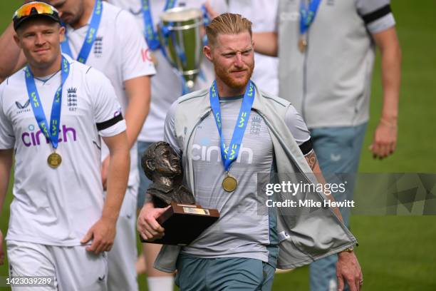 England captain Ben Stokes walks off with the series trophy after day five of the Third LV= Insurance Test Match between England and South Africa at...