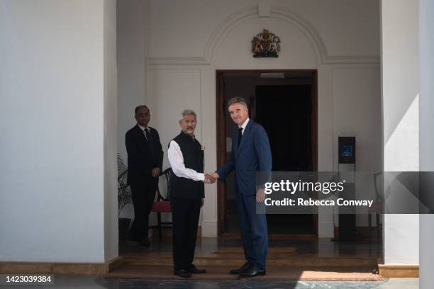 India's External Affairs Minister Dr. S. Jaishankar shakes hands with British High Commissioner to the Republic of India Alexander Ellis as he...