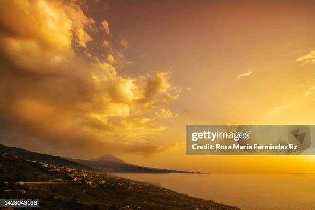 sunset landscape over atlanctic ocean with  mount teide volcano on background. - golden hour stock pictures, royalty-free photos & images