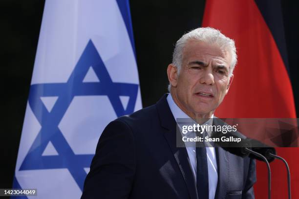 Interim Israeli Prime Minister Yair Lapid and German Chancellor Olaf Scholz speak to the media following talks at the Chancellery on September 12,...