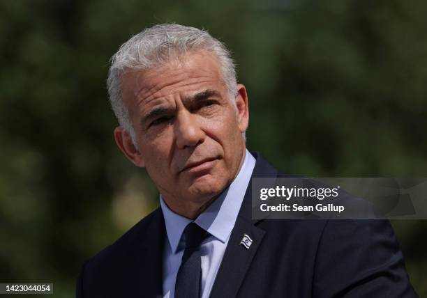 Interim Israeli Prime Minister Yair Lapid and German Chancellor Olaf Scholz speak to the media following talks at the Chancellery on September 12,...