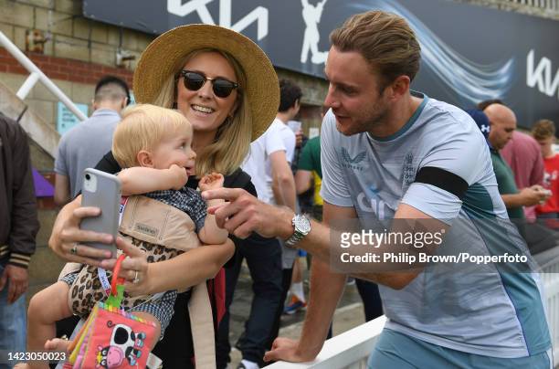 Stuart Broad of England meets a young spectator after England won the third Test and the series against South Africa at The Kia Oval on September 12,...
