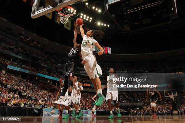 Brittney Griner of the Baylor Bears reaches for a rebound in the second half against Chiney Ogwumike of the Stanford Cardinal during the National...