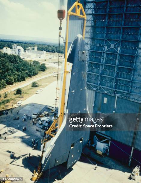 Space Shuttle Enterprise in a vertical position as it is hoisted into the Saturn V Dynamic Test Stand for testing, at the George C Marshall Space...