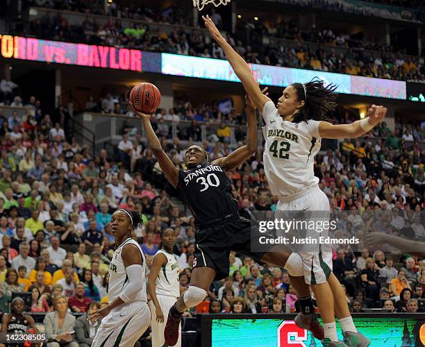 Nnemkadi Ogwumike of the Stanford Cardinal drives for a shot attempt in the second half against the Brittney Griner of the Baylor Bears during the...