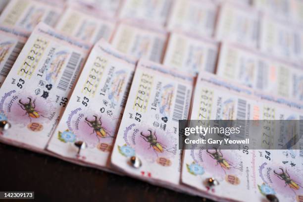 close up of thai lottery tickets on street stall - lotteri bildbanksfoton och bilder