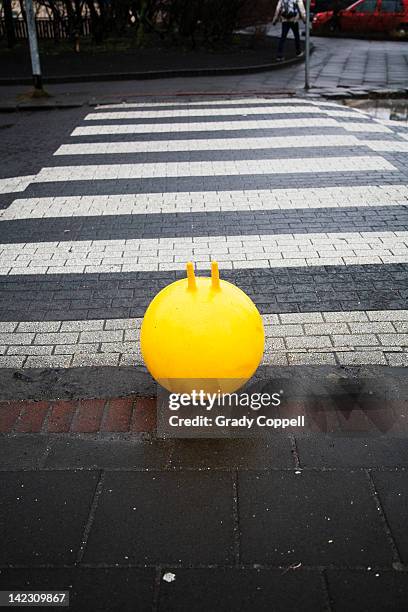 bouncy toy at pedestrian crossing - space hopper stock pictures, royalty-free photos & images