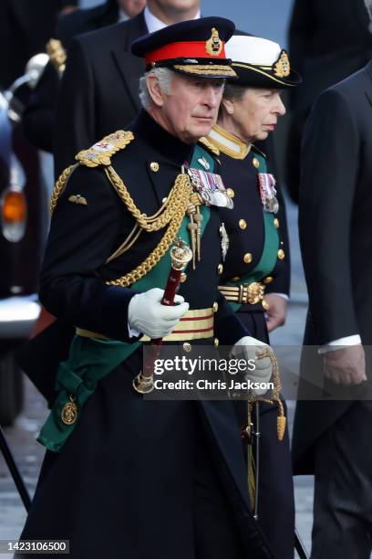 King Charles III and Princess Anne, Princess Royal arrive with Queen Elizabeth II’s funeral cortege as it made its way along The Royal Mile to St...