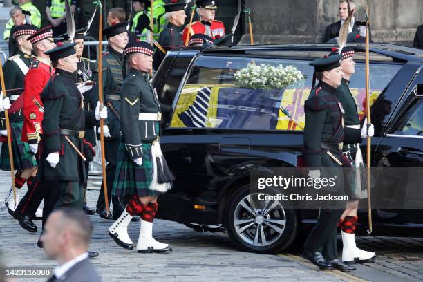 Queen Elizabeth II’s funeral cortege makes its way along The Royal Mile towards St Giles Cathedral on September 12, 2022 in Edinburgh, Scotland. King...