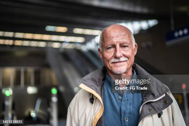 portrait of a senior man in a subway station - goatee stock pictures, royalty-free photos & images