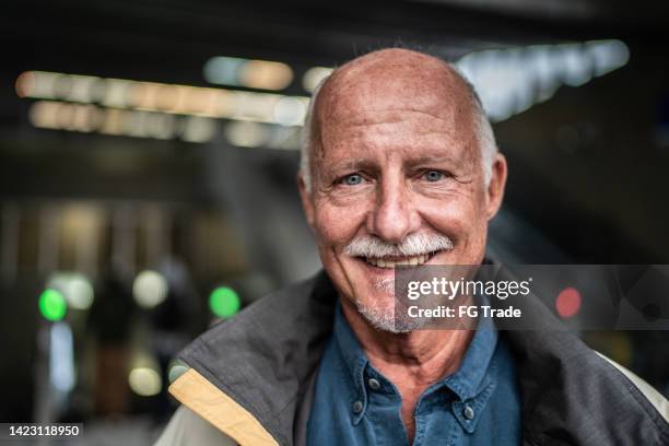 portrait of a senior man in a subway station - mustache stock pictures, royalty-free photos & images