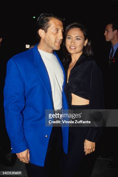 Producer Elie Samaha and Actress Tia Carrere attend the 'Emprio of Arabia' Morrocan Themed Celebration for the Opening of New Emporio Armani Boutique...