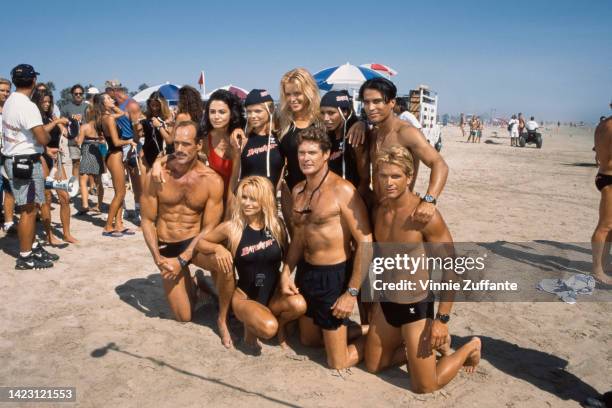 The Cast of Baywatch with competitors of 'Uncle Toby's Aussie Ironman Competition' pose together on the beach during the taping of an episode,...