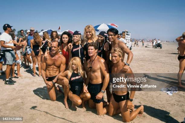 The Cast of Baywatch with competitors of 'Uncle Toby's Aussie Ironman Competition' pose together on the beach during the taping of an episode,...