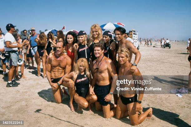 The Cast of Baywatch with competitors of 'Uncle Toby's Aussie Ironman Competition' pose together on the beach during the taping of an episode,...