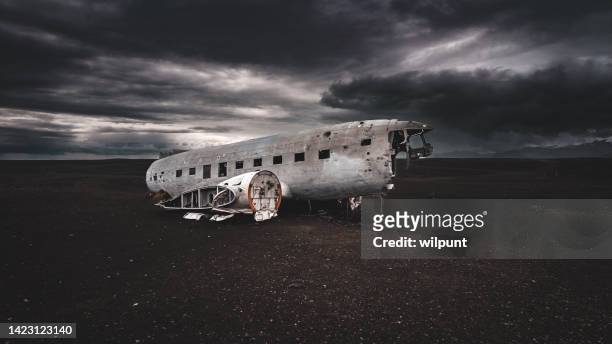 eerie dramatic light on wrecked dc-3 plane on sólheimasandur - air crash investigation stock pictures, royalty-free photos & images