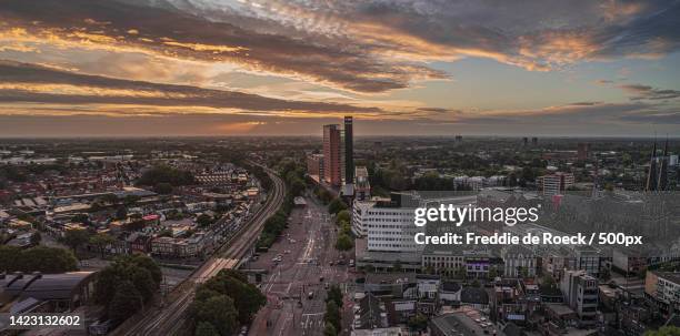 high angle view of city buildings against sky during sunset,spoorlaan,tilburg,netherlands - north brabant stock pictures, royalty-free photos & images