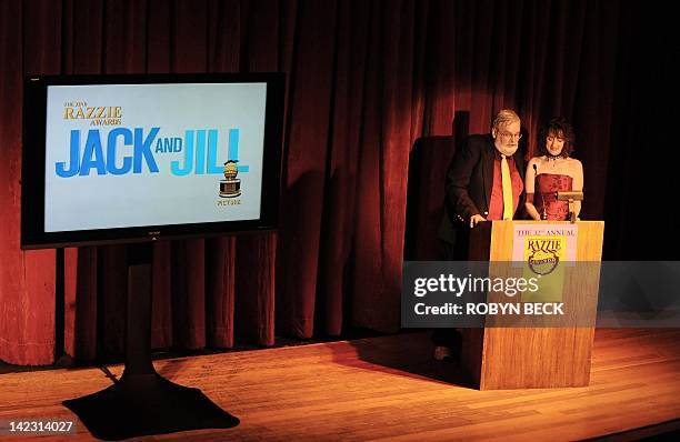 John Wilson and Kelie McIver announce the movie "Jack and Jill" as the winner of the "Worst Picture" award, on stage at the 32 annual Golden...