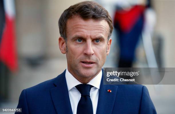 French President Emmanuel Macron makes a statement prior to a working dinner with Greek Prime Minister Kyriakos Mitsotakis at the Elysee Presidential...