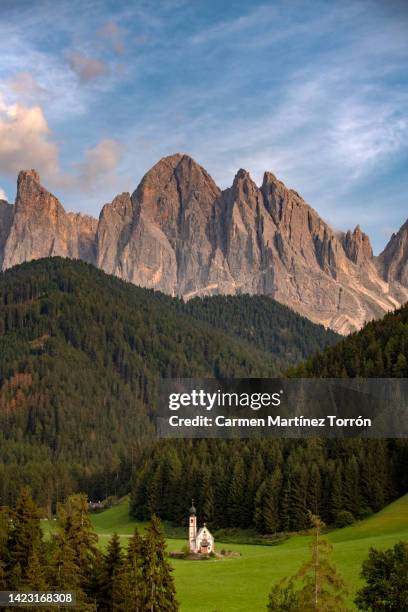 santa maddalena church in val di funes, village in the dolomites mountain peaks. - adige stock pictures, royalty-free photos & images