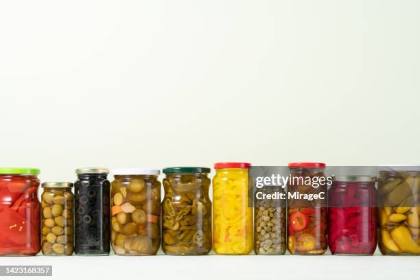 preserved vegetables and pickled vegetables sealed in glass jars - fermenting stock pictures, royalty-free photos & images