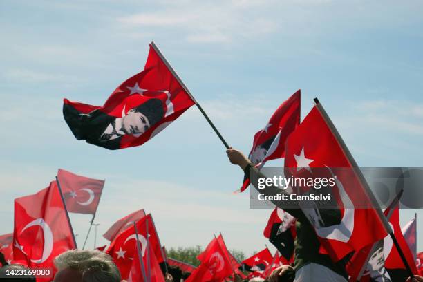 turkish flags raised in the hands of people - august stock pictures, royalty-free photos & images