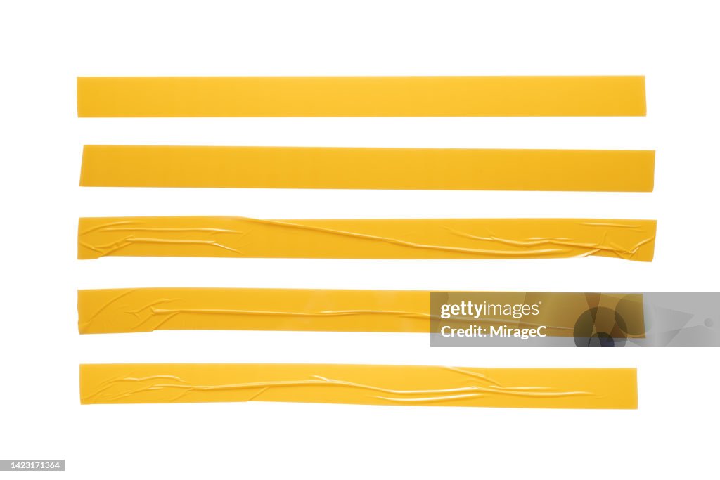Yellow Plastic Adhesive Tape Long Stripes Isolated on White