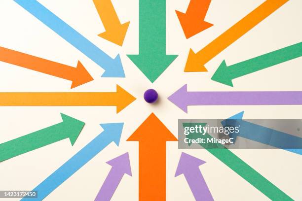 concentrated arrows focus on a sphere point - decisions stock pictures, royalty-free photos & images