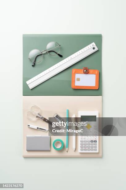 neatly arranged school supplies for college on green - manilla folder stock pictures, royalty-free photos & images