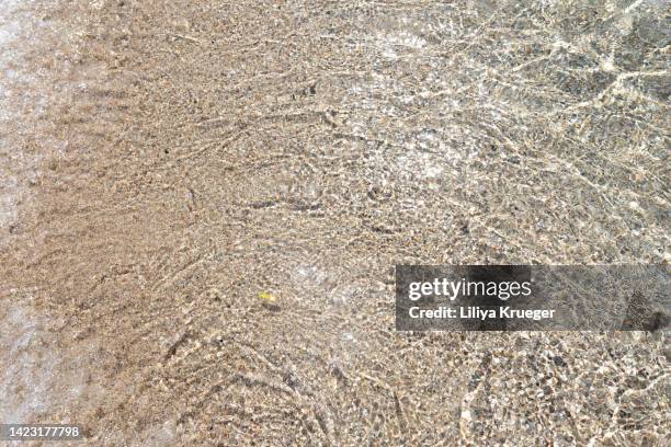 abstract background with sea sand washed by the sea. - cliff texture stockfoto's en -beelden