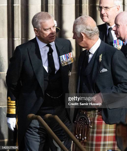 Prince Andrew, Duke of York and King Charles III leave after attending the vigil in memory of Queen Elizabeth II at St Giles Cathedral on September...