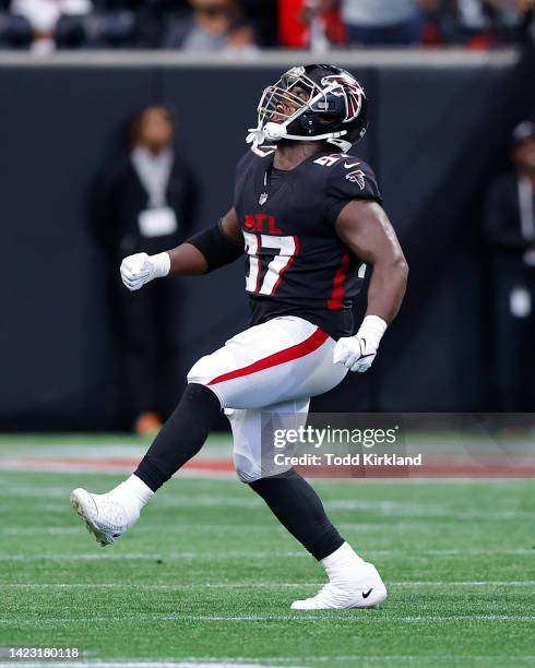 Grady Jarrett of the Atlanta Falcons reacts after a sack during the first half of the game against the New Orleans Saints at Mercedes-Benz Stadium on...