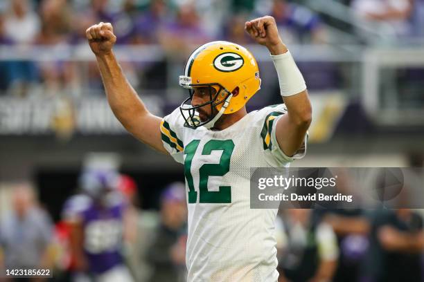 Aaron Rodgers of the Green Bay Packers celebrates a touchdown against the Minnesota Vikings in the third quarter of the game at U.S. Bank Stadium on...