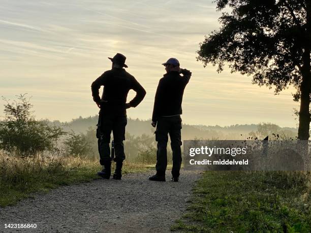 foresters checking the parkland - forester stock pictures, royalty-free photos & images