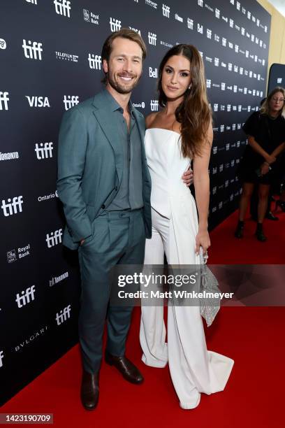 Glen Powell and Gigi Paris attend the "Devotion" Premiere at Cinesphere on September 12, 2022 in Toronto, Ontario.