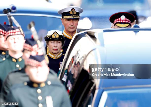 Princess Anne, Princess Royal and Vice Admiral Sir Timothy Laurence take part in a procession escorting Queen Elizabeth II's coffin along The Royal...