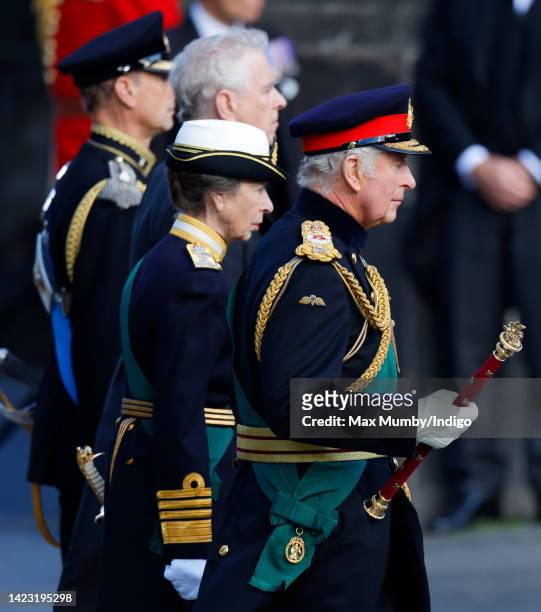 King Charles III, Princess Anne, Princess Royal, Prince Andrew, Duke of York and Prince Edward, Earl of Wessex walk along The Royal Mile as they...