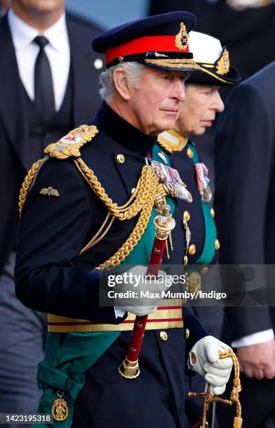 King Charles III and Princess Anne, Princess Royal walk along The Royal Mile as they accompany Queen Elizabeth II's coffin to St Giles' Cathedral for...