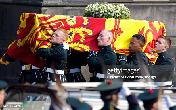 Queen Elizabeth II's coffin, draped in the Royal Standard of Scotland, is carried into St Giles' Cathedral for a Service of Thanksgiving on September...