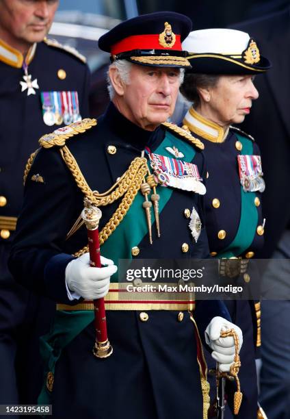 King Charles III and Princess Anne, Princess Royal walk along The Royal Mile as they accompany Queen Elizabeth II's coffin to St Giles' Cathedral for...