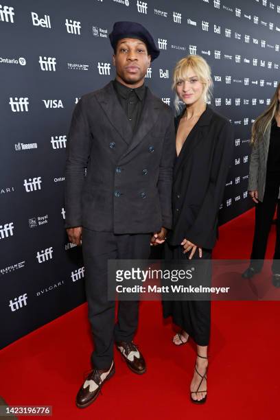 Jonathan Majors and guest attend the "Devotion" Premiere at Cinesphere on September 12, 2022 in Toronto, Ontario.