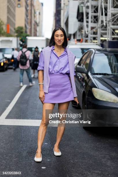 Eva Chen wearing lavender button shirt, skirt, jumper outside Carolina Herrera on September 12, 2022 in New York City.