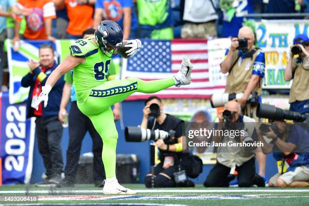 Will Dissly of the Seattle Seahawks celebrates after scoring a touchdown during the first quarter against the Denver Broncos at Lumen Field on...