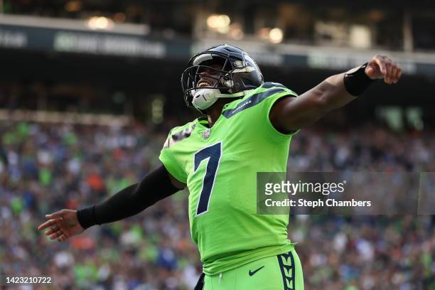 Geno Smith of the Seattle Seahawks celebrates during the first quarter against the Denver Broncos at Lumen Field on September 12, 2022 in Seattle,...